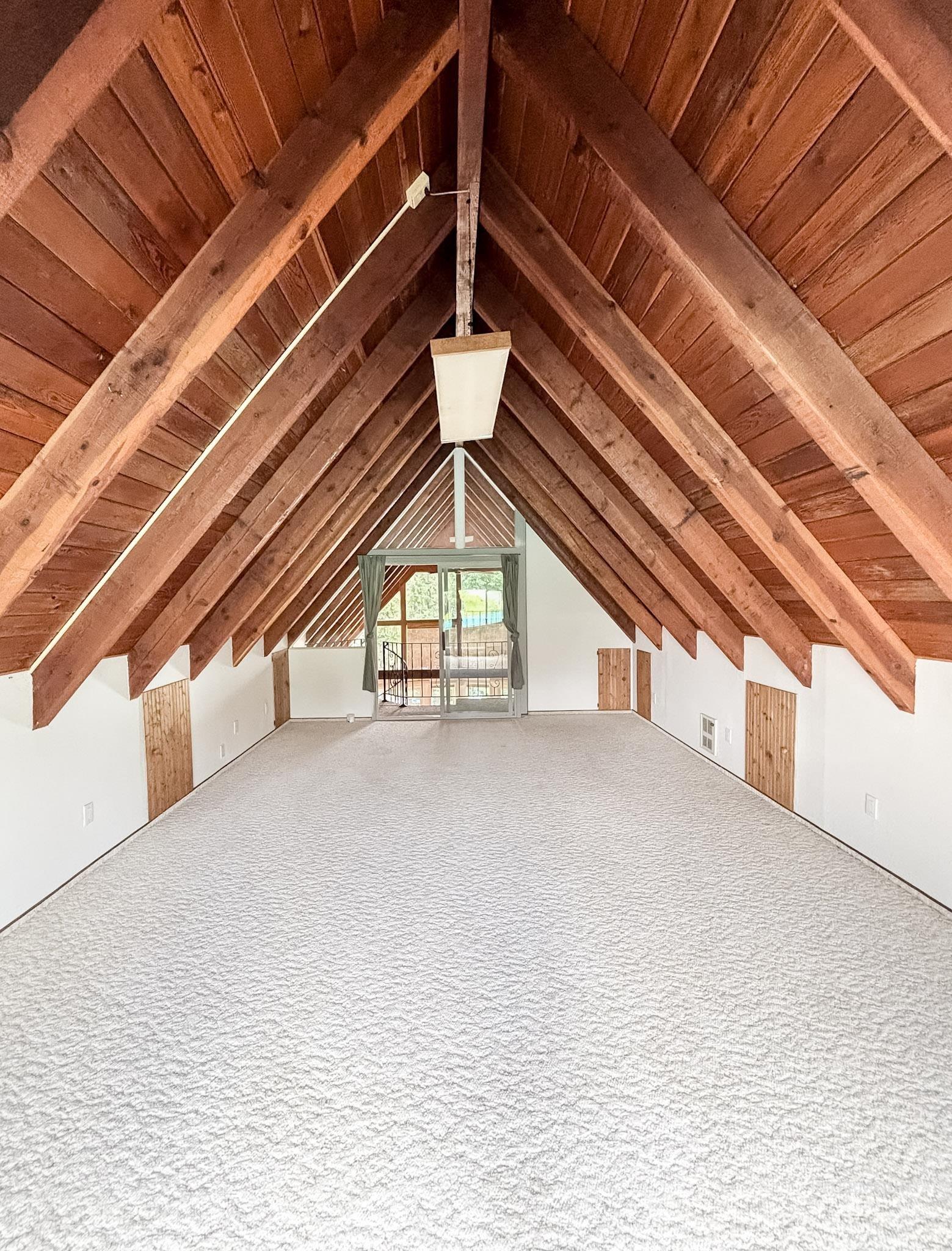302 Rossiter Court Pierce, ID 83546 - Photo 20 of 30 A-frame ceiling featuring exposed wood beams and plank paneling