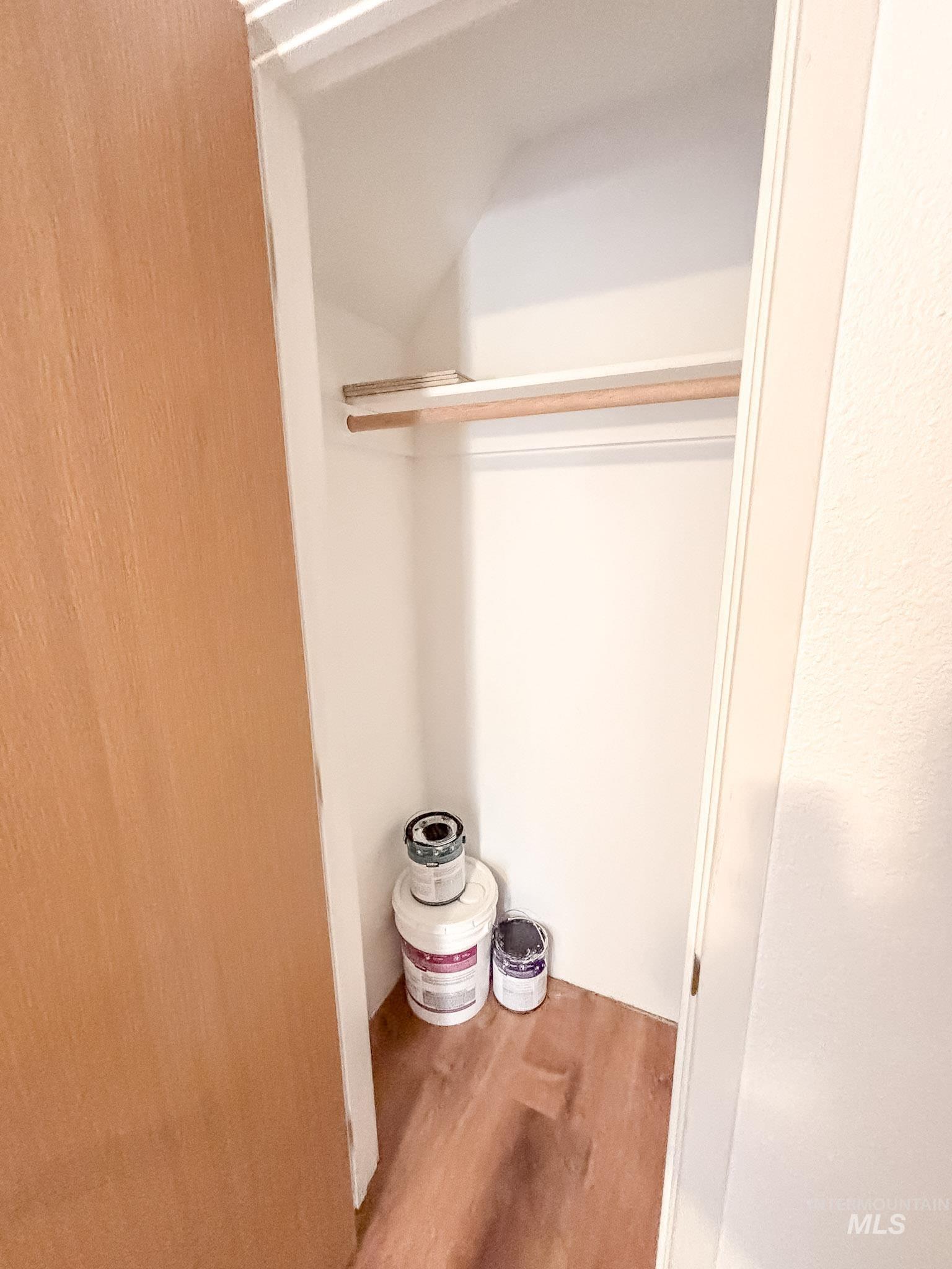 302 Rossiter Court Pierce, ID 83546 - Photo 23 of 30 White-painted closet featuring a built-in wooden hanging rod and a high shelf