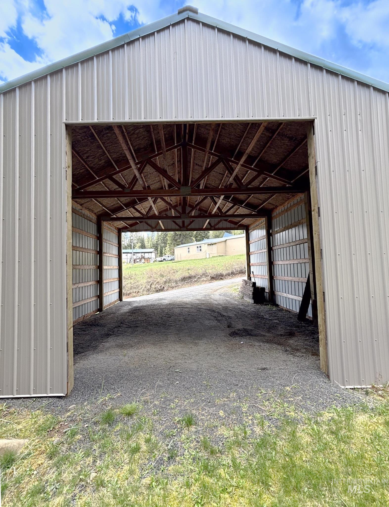 302 Rossiter Court Pierce, ID 83546 - Photo 26 of 30 Metal-sided structure featuring a gabled roofline and exposed interior framing