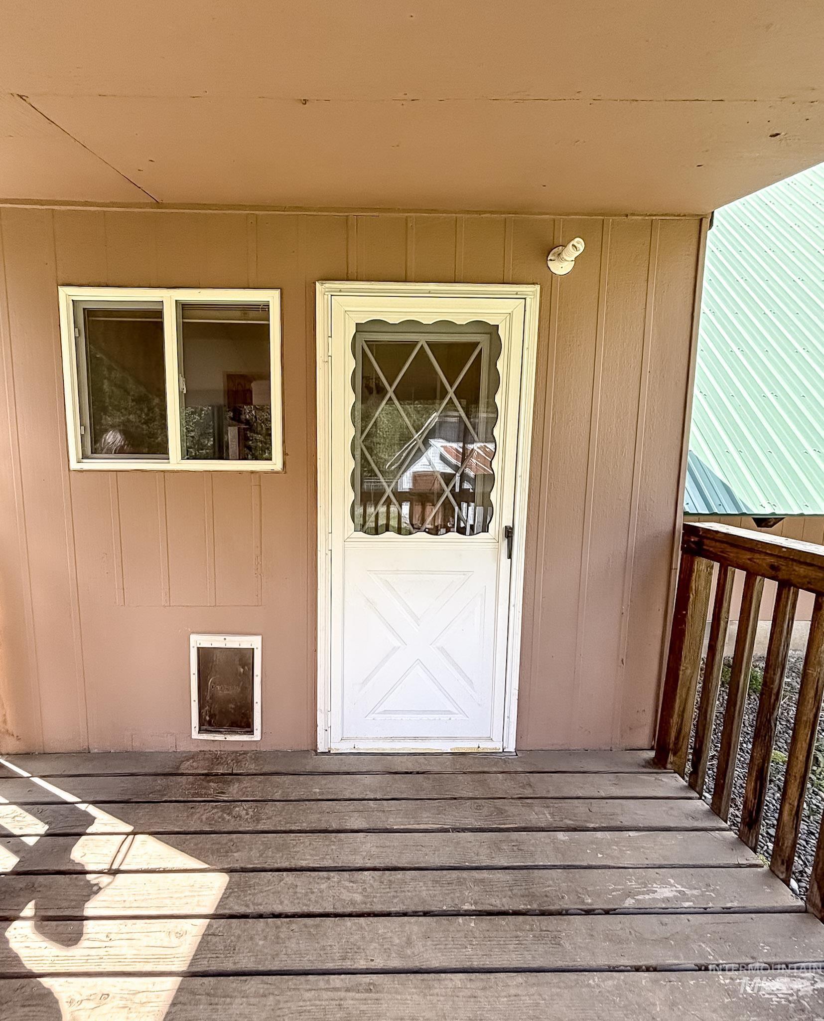 302 Rossiter Court Pierce, ID 83546 - Photo 5 of 30 Covered porch with wood-finish decking and rustic wood railing