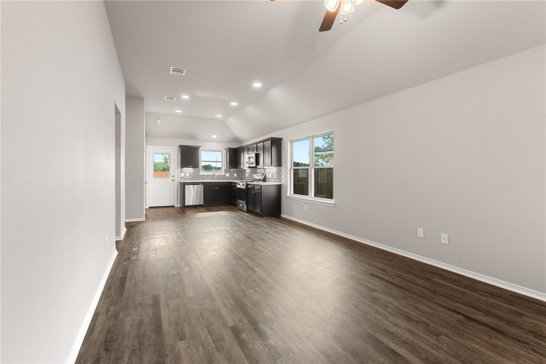 2869 Messenger Way Bryan, TX 77803 - Photo 5 of 23 a view of kitchen and hall with wooden floor