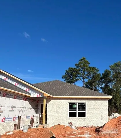 a view of house with outdoor space and swimming pool