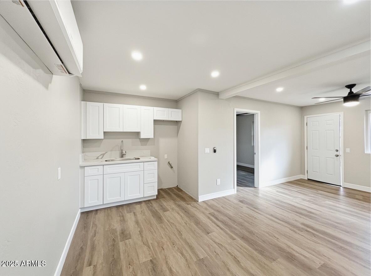 513 East Hatcher Road, Unit 6 Phoenix, AZ 85020 - Photo 1 of 8 a view of a kitchen with wooden floor and a sink