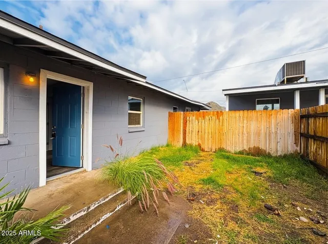 a view of backyard with seating space