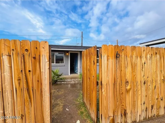 a view of a door with wooden walls