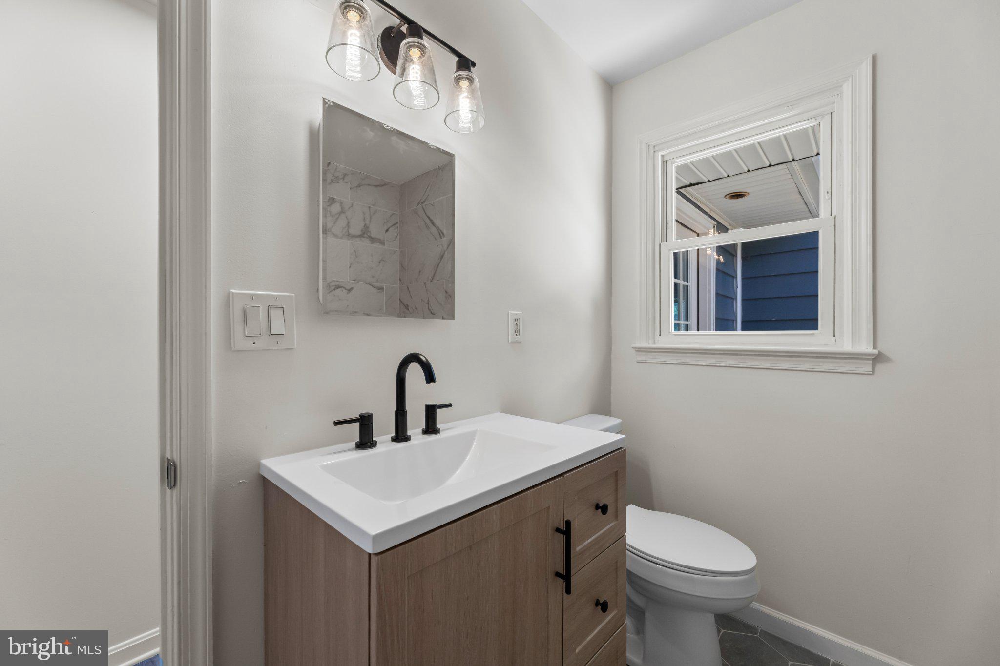 12 Oak Street Cambridge, MD 21613 - Photo 17 of 30 Modern elegance in a cozy bathroom.