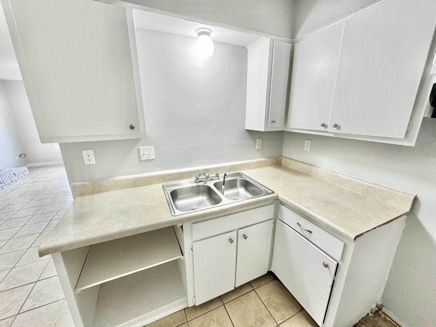 3536 Christine Road Memphis, TN 38118 - Photo 4 of 15 a utility room with cabinets washer and dryer
