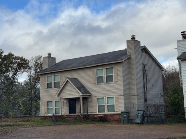 3536 Christine Road Memphis, TN 38118 - Photo 6 of 15 a front view of a house with a garden