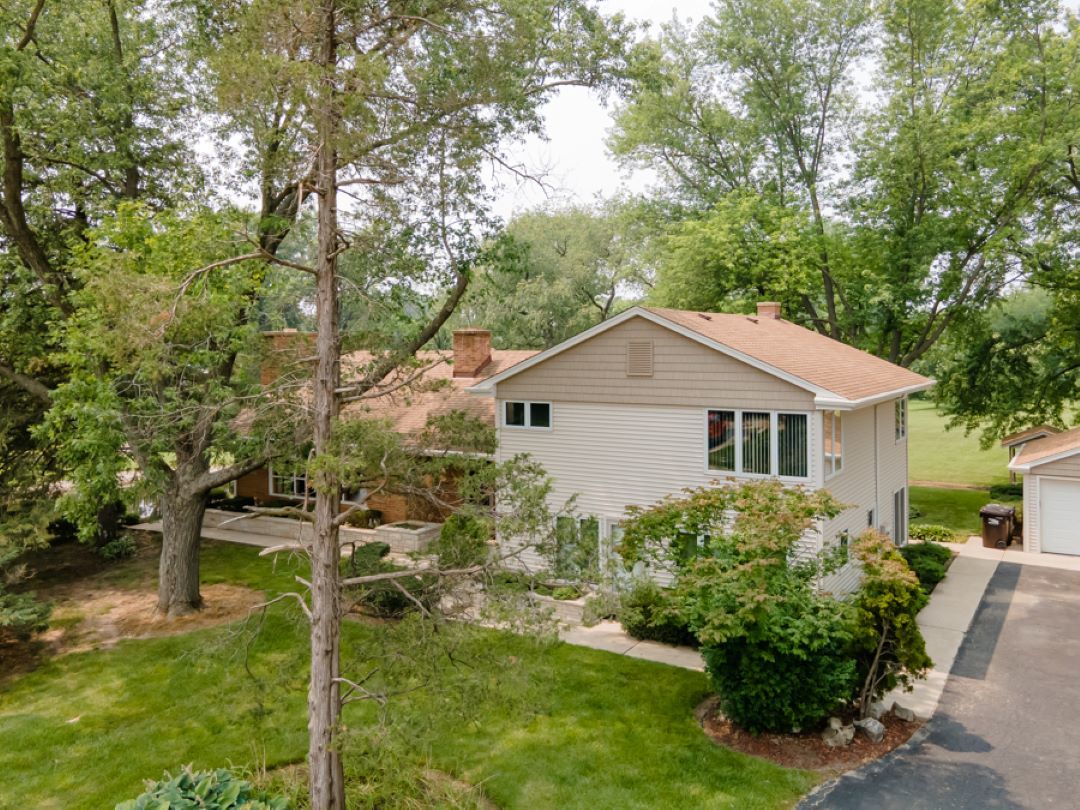 161 Thomas Court Wauconda, IL 60084 - Photo 1 of 33 a house with trees in front of it