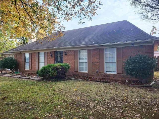a view of house with yard and outdoor space
