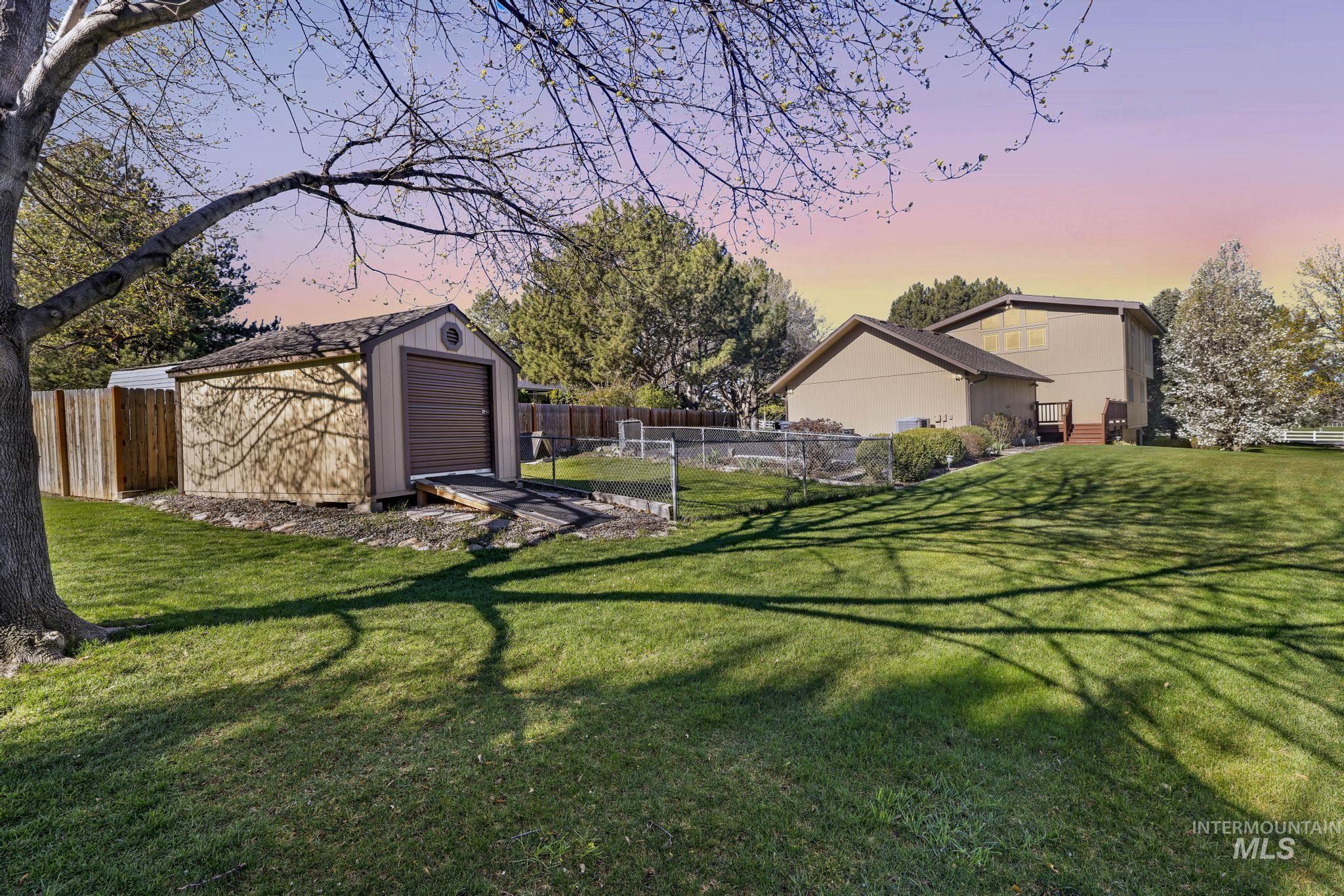1172 Hankins Road North Twin Falls, ID 83301 - Photo 11 of 49 Fenced backyard featuring a shed