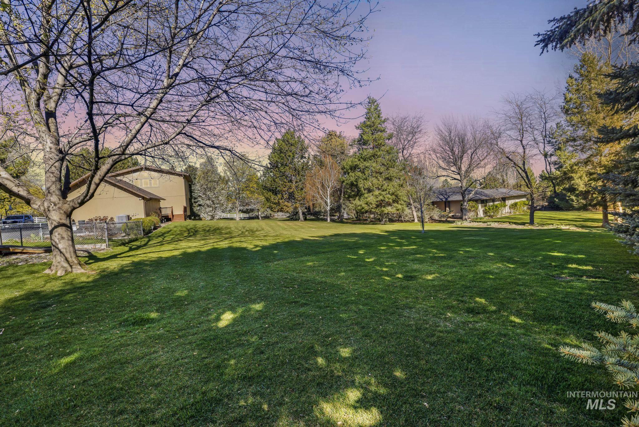 1172 Hankins Road North Twin Falls, ID 83301 - Photo 12 of 49 Yard at dusk with view of scattered trees