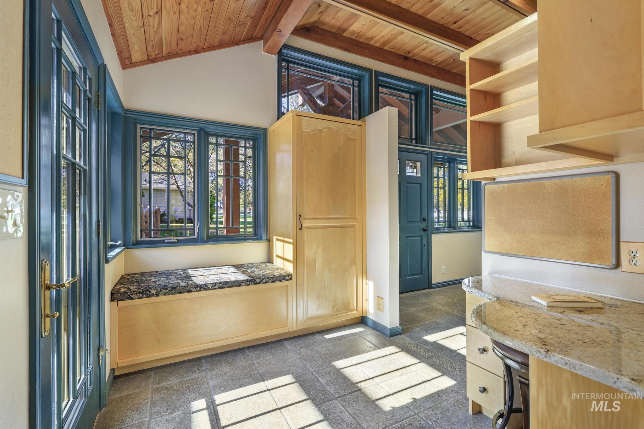 1172 Hankins Road North Twin Falls, ID 83301 - Photo 23 of 49 Mudroom with a wood ceiling with exposed beams, healthy amount of natural light, and granite tiled floors