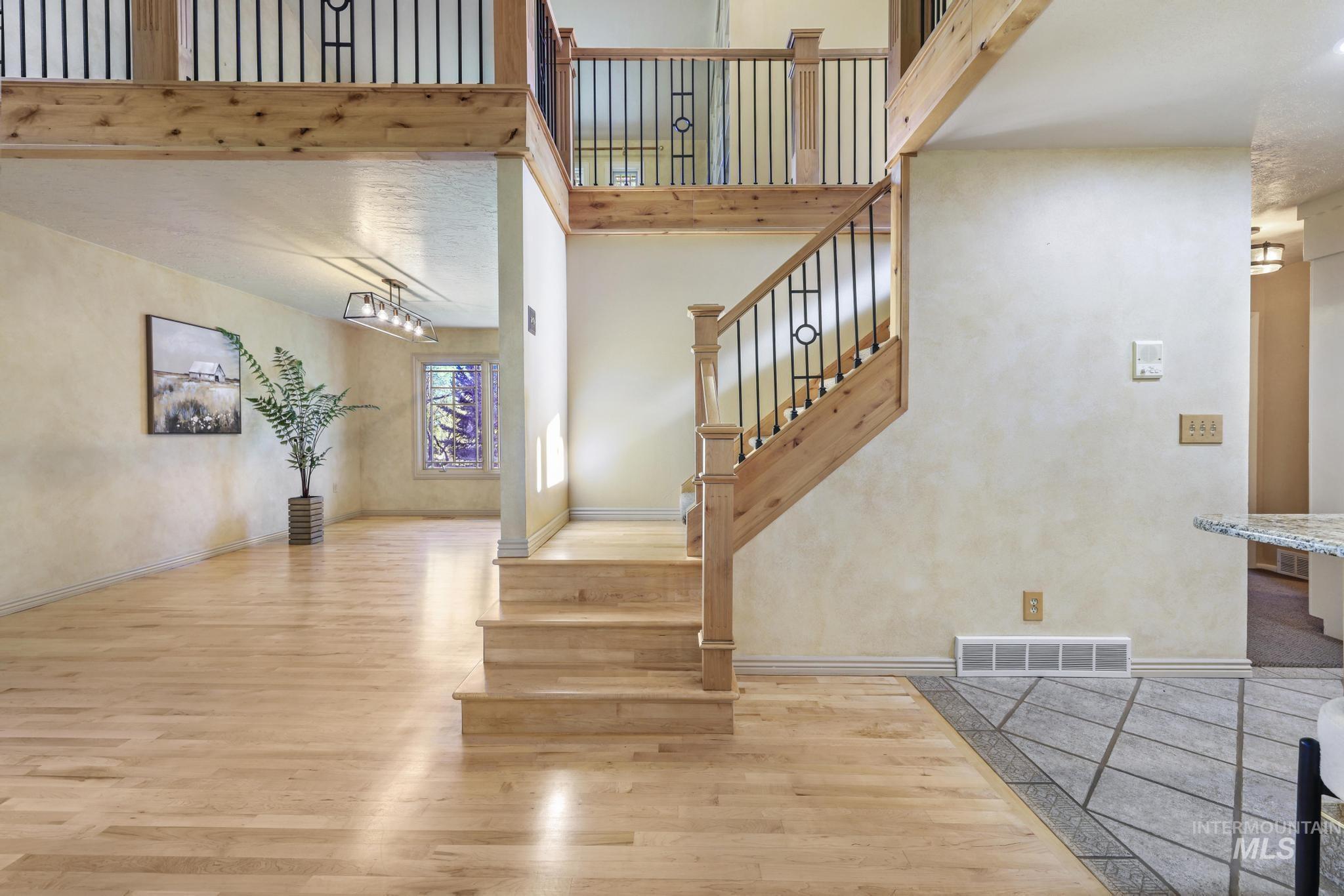 1172 Hankins Road North Twin Falls, ID 83301 - Photo 29 of 49 Stairs featuring wood finished floors and a high ceiling