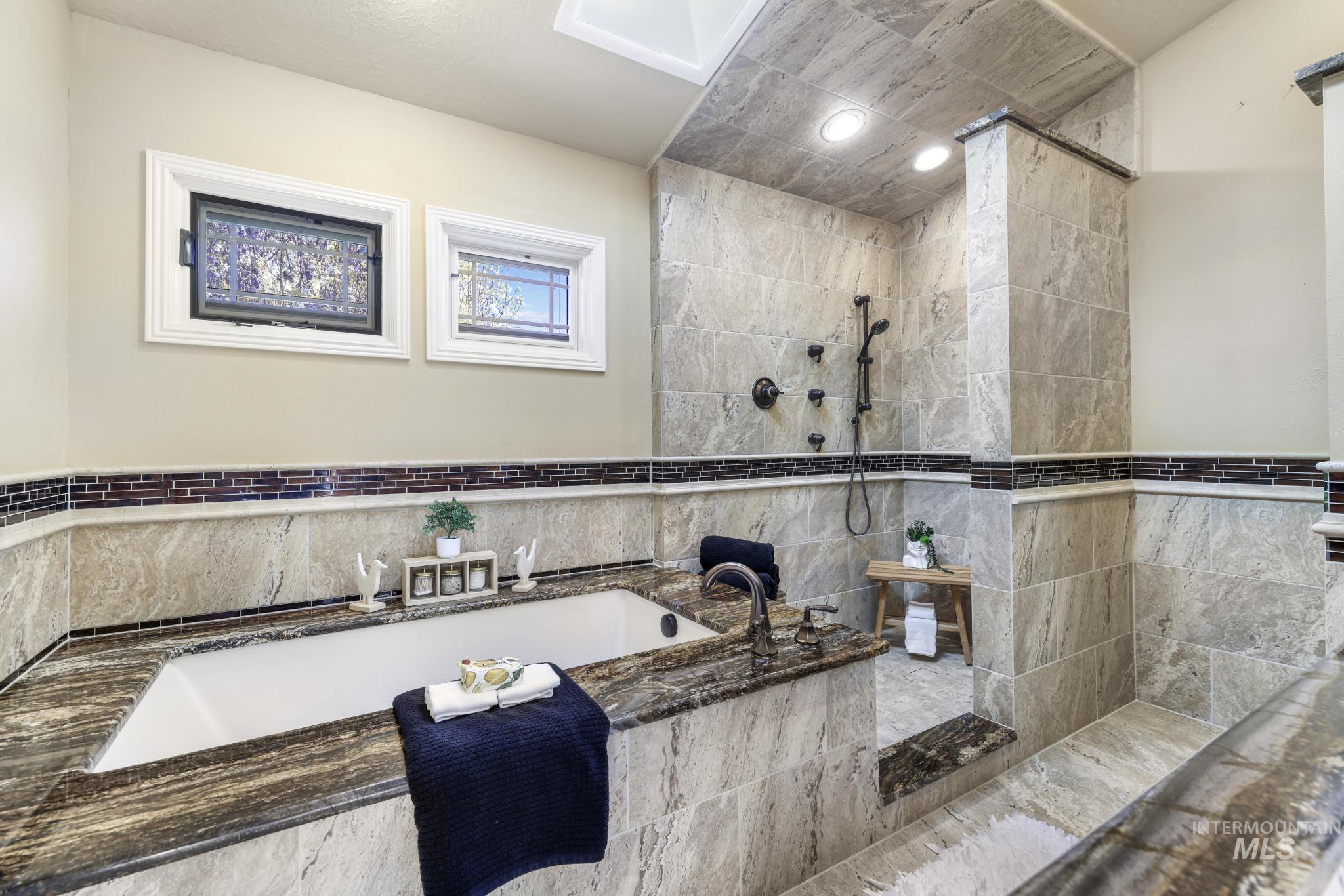 1172 Hankins Road North Twin Falls, ID 83301 - Photo 35 of 49 Full bathroom with a bath and walk in shower