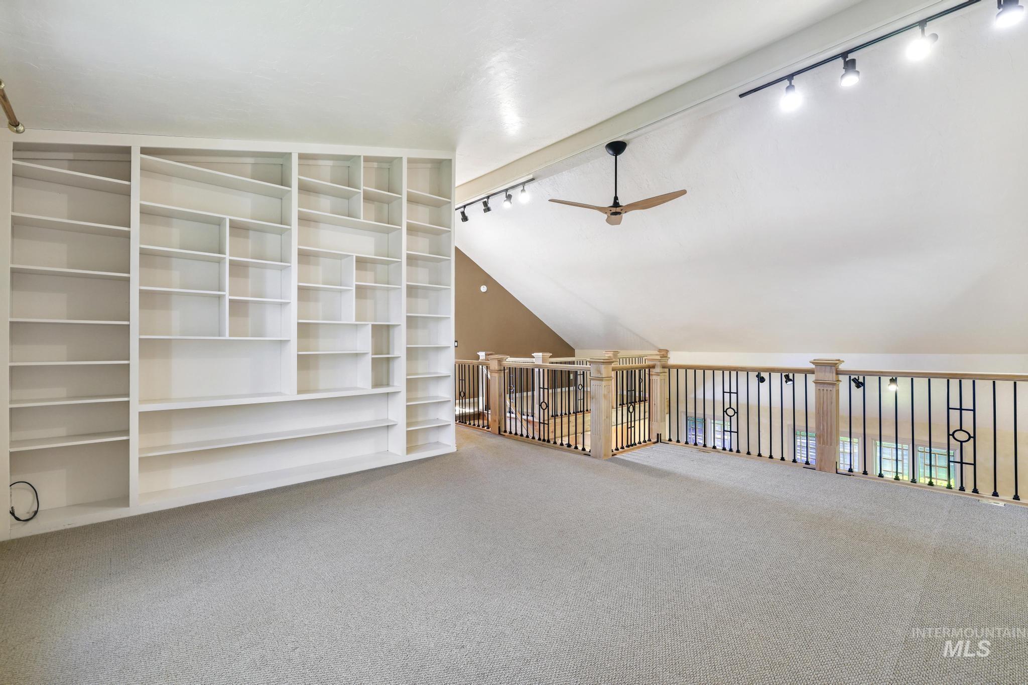 1172 Hankins Road North Twin Falls, ID 83301 - Photo 36 of 49 Additional living space featuring carpet flooring, ceiling fan, and lofted ceiling with beams