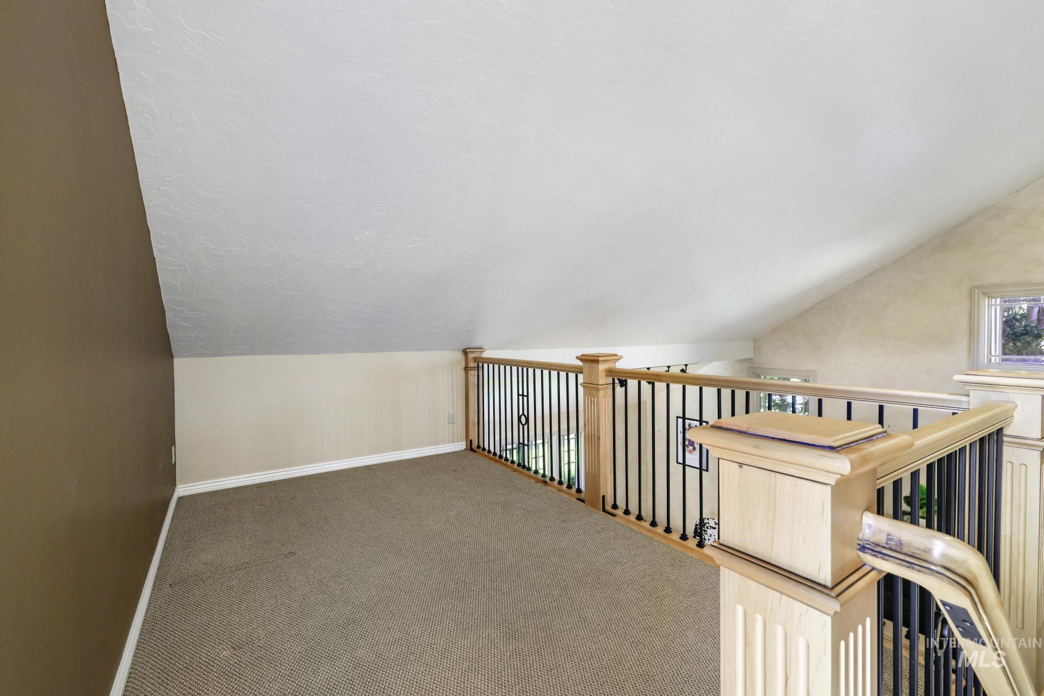 1172 Hankins Road North Twin Falls, ID 83301 - Photo 37 of 49 Bonus room with vaulted ceiling and carpet