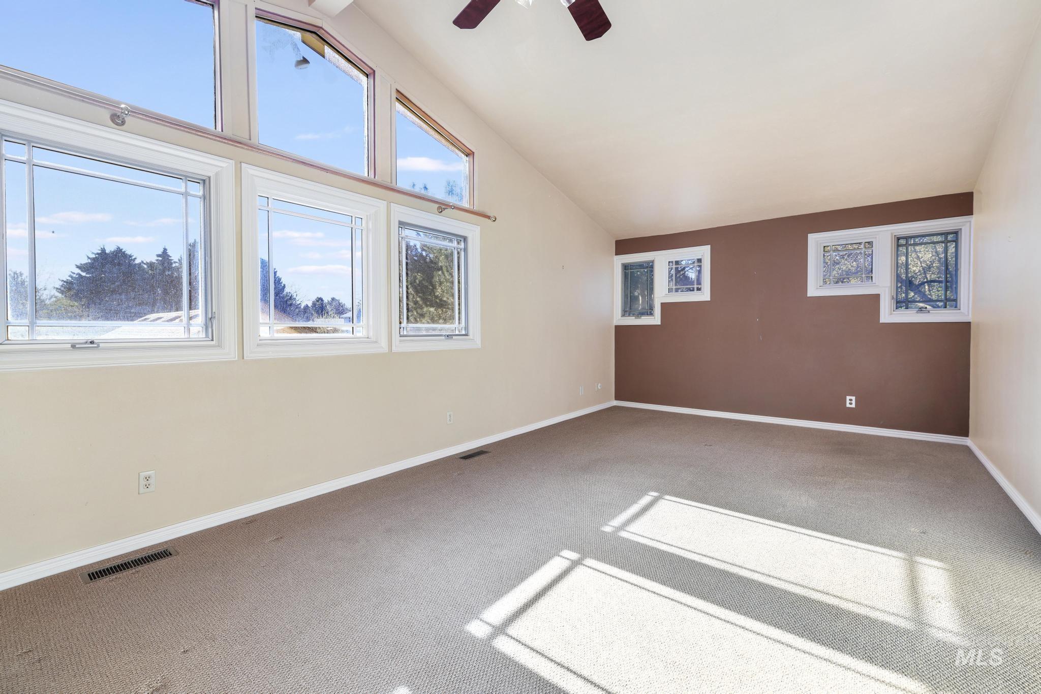 1172 Hankins Road North Twin Falls, ID 83301 - Photo 38 of 49 Bonus room featuring vaulted ceiling, light carpet, and ceiling fan