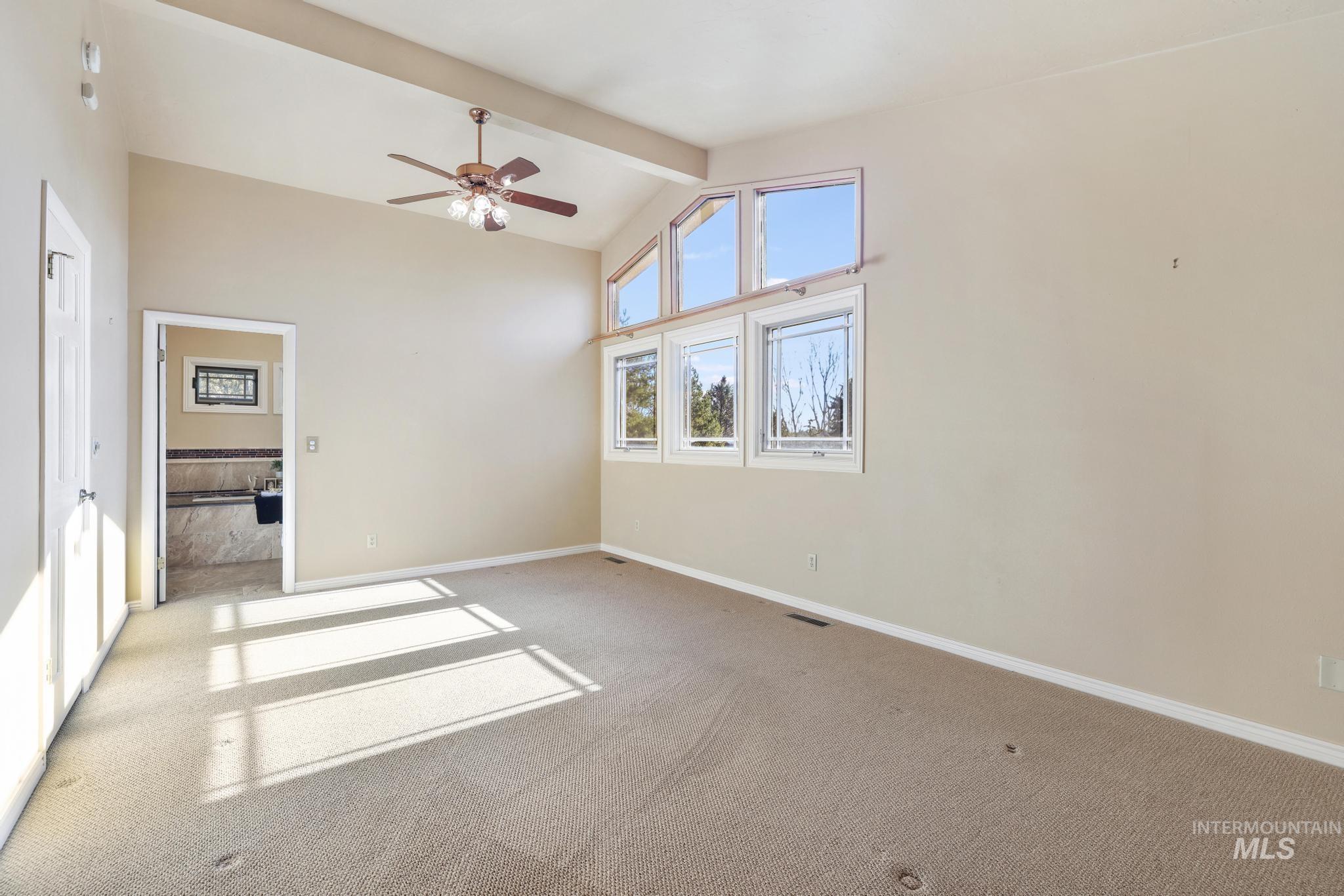 1172 Hankins Road North Twin Falls, ID 83301 - Photo 39 of 49 Unfurnished room with light colored carpet and a ceiling fan