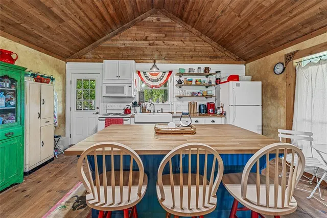 a table and chairs in a small room