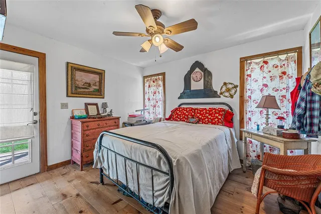 a patio with wooden cabinets and outdoor seating