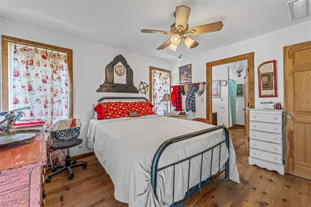 a backyard of a house with plants and outdoor seating