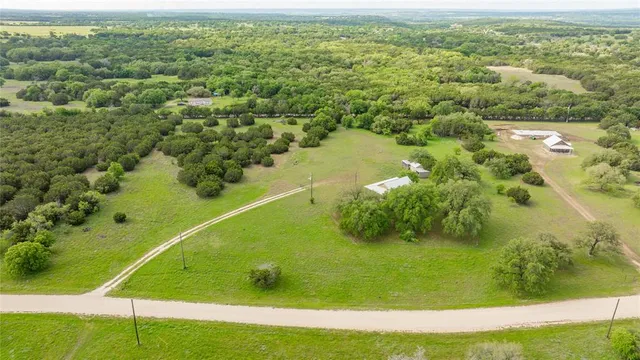 a view of a lake with a yard
