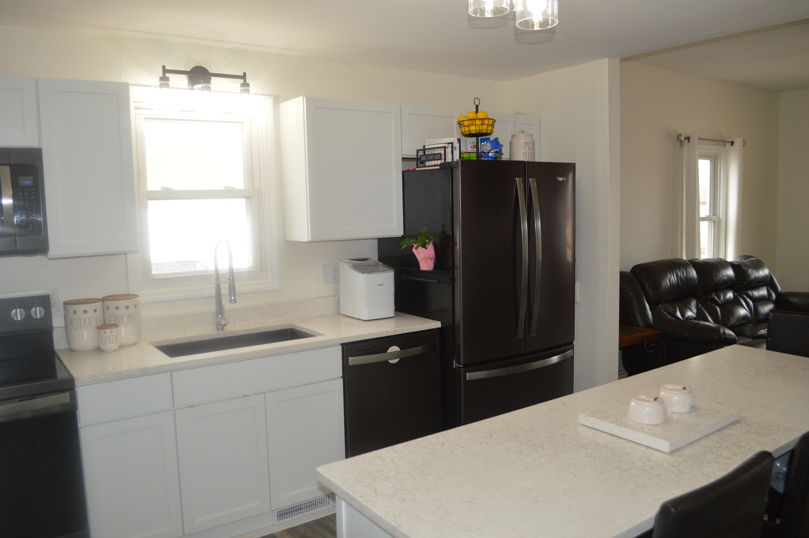 108 North Milwaukee Street Mark, IL 61340 - Photo 11 of 29 a kitchen with a refrigerator and a sink