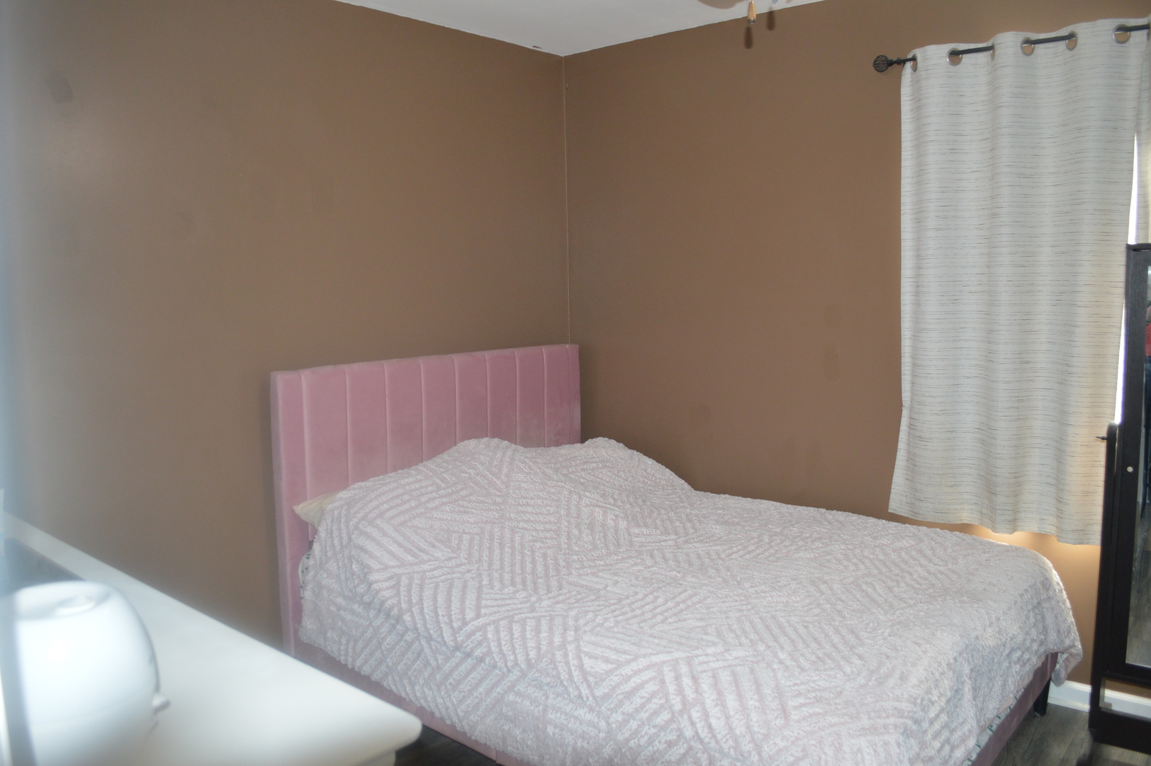 108 North Milwaukee Street Mark, IL 61340 - Photo 16 of 29 a bedroom with a bed and curtain