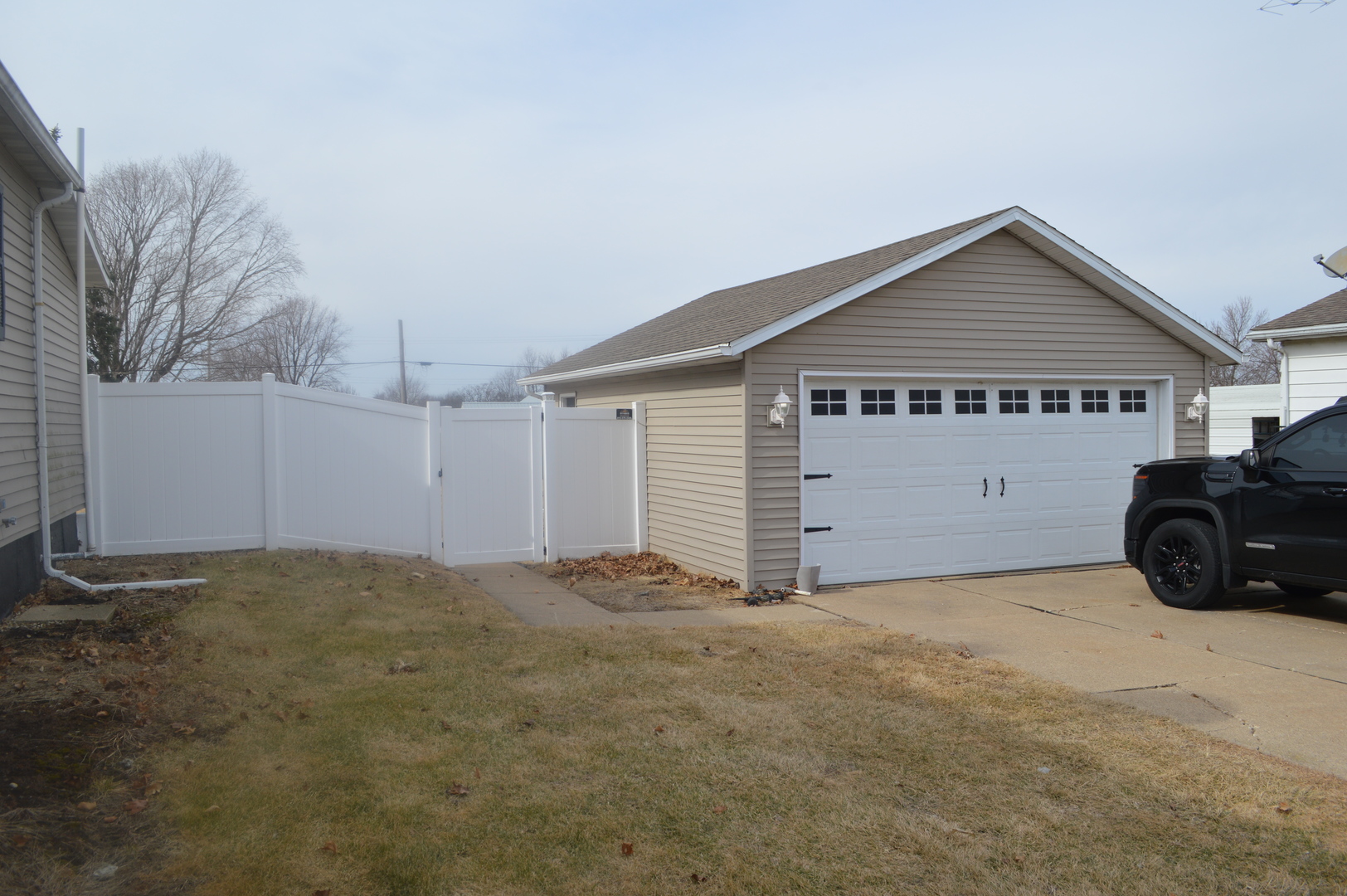 108 North Milwaukee Street Mark, IL 61340 - Photo 4 of 29 a view of a house with a yard and garage