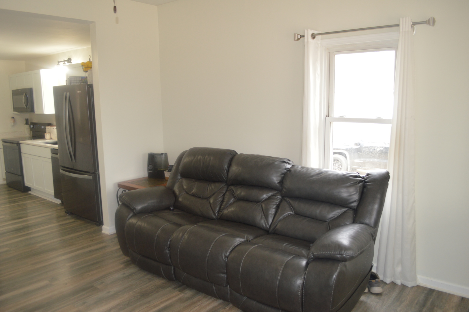 108 North Milwaukee Street Mark, IL 61340 - Photo 6 of 29 a living room with furniture and a window