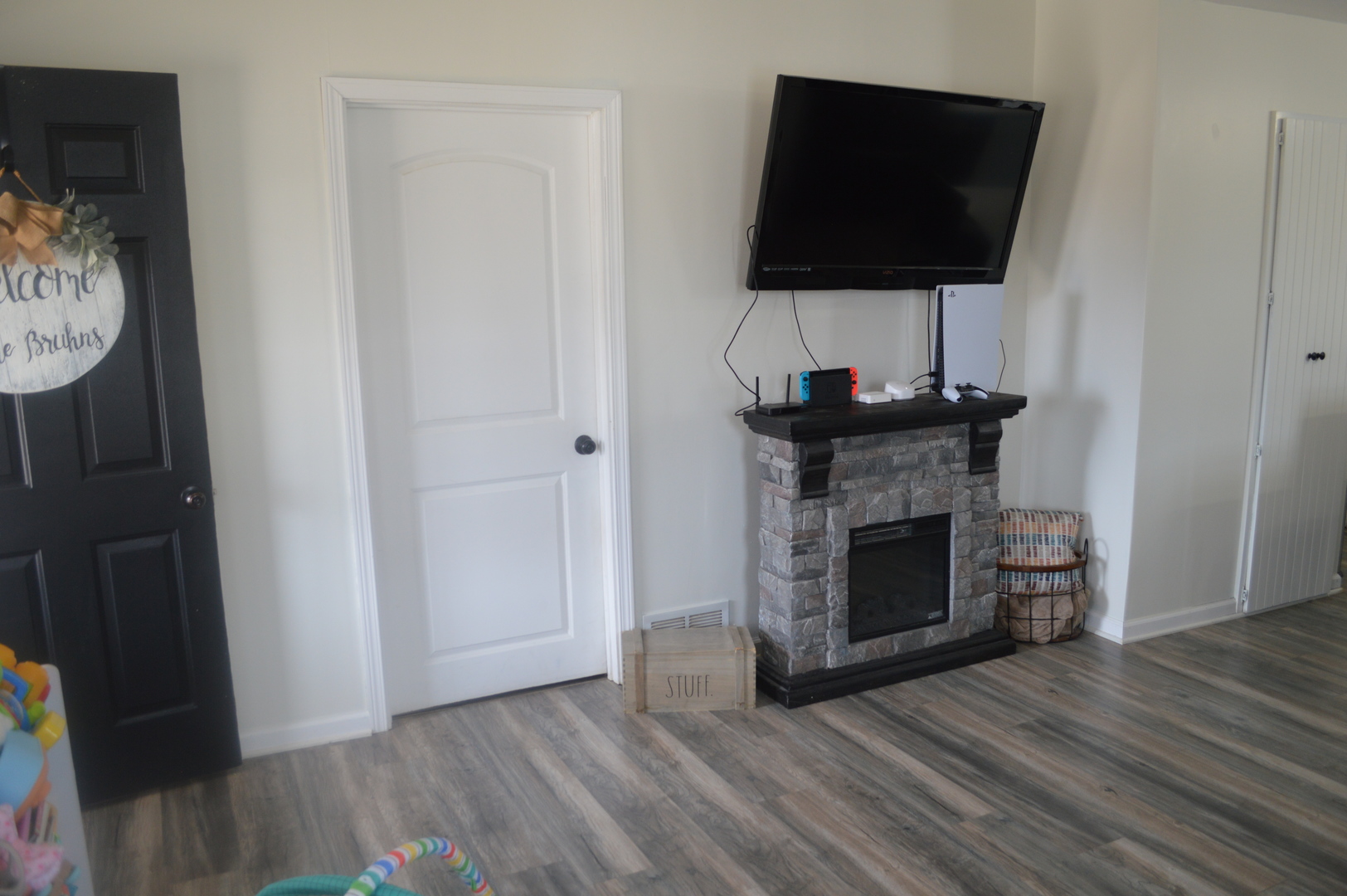 108 North Milwaukee Street Mark, IL 61340 - Photo 8 of 29 a living room with a fireplace and a flat screen tv