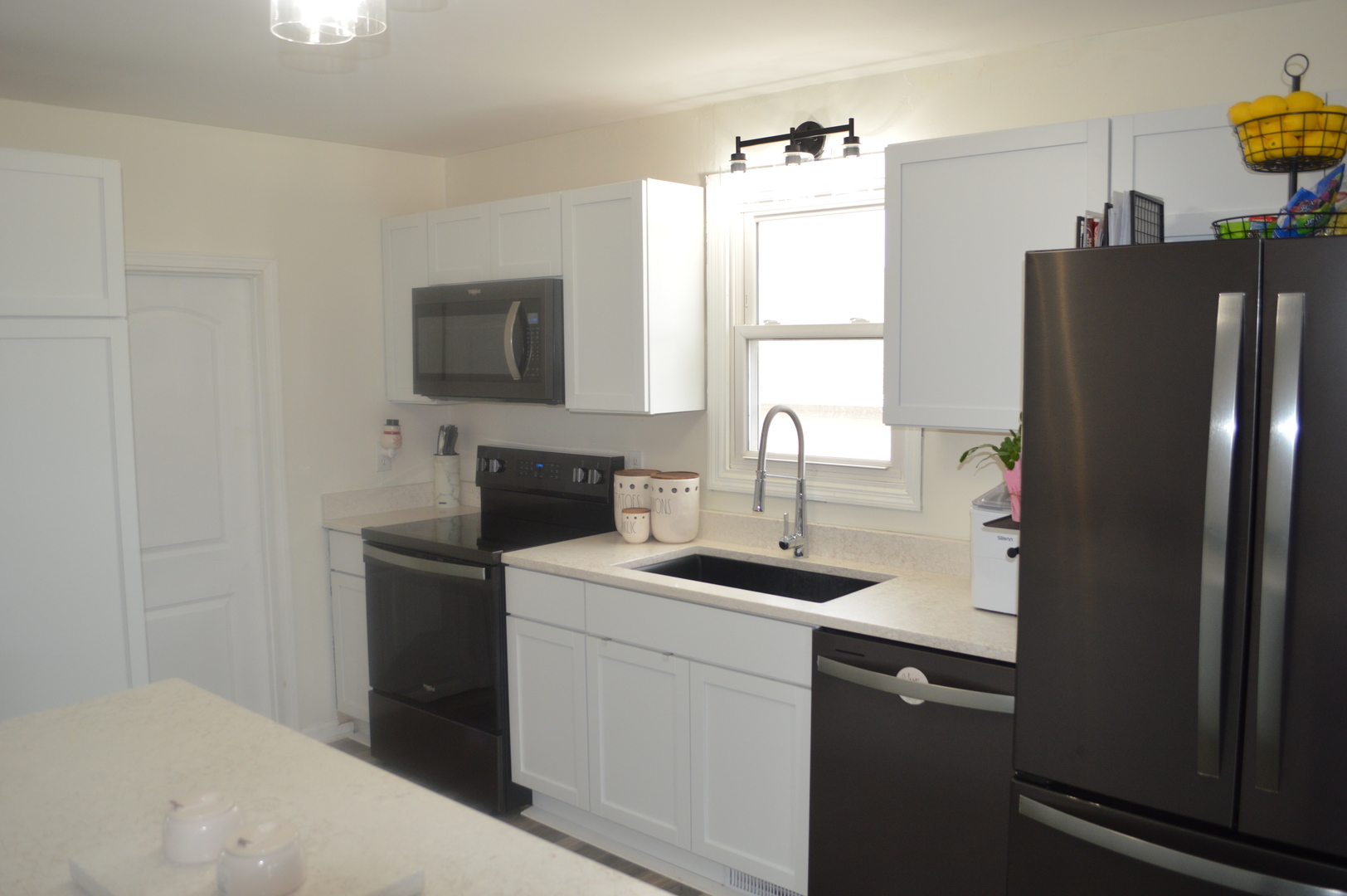 108 North Milwaukee Street Mark, IL 61340 - Photo 10 of 29 a kitchen with a sink and refrigerator