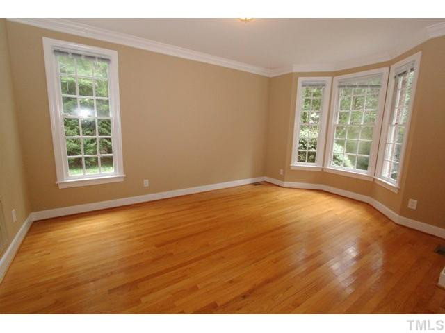 820 Nolstead Court Raleigh, NC 27614 - Photo 3 of 25 Formail living room features crown molding & bay window. Living Room