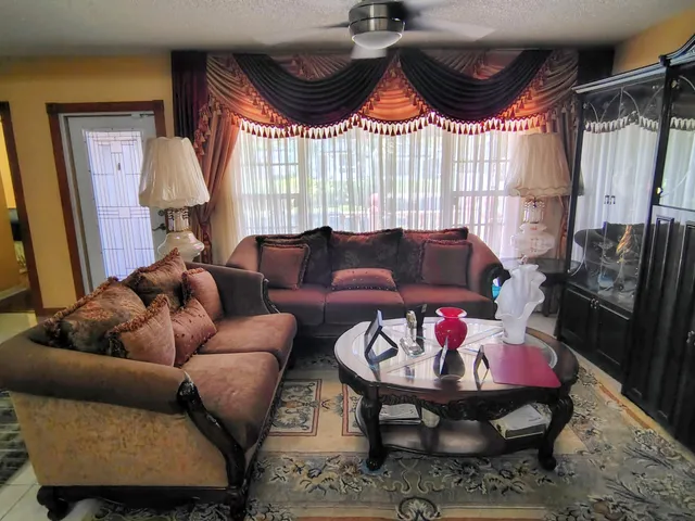 a living room with furniture and a window