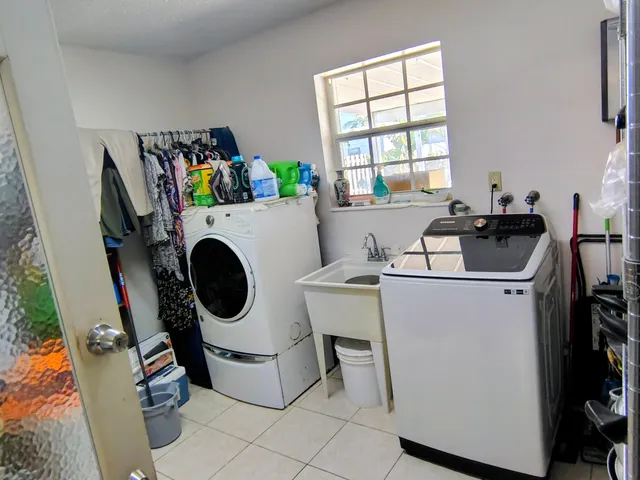 a utility room with dryer and washer