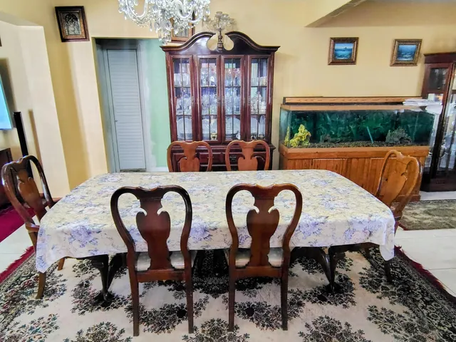 a view of a dining room with furniture and window