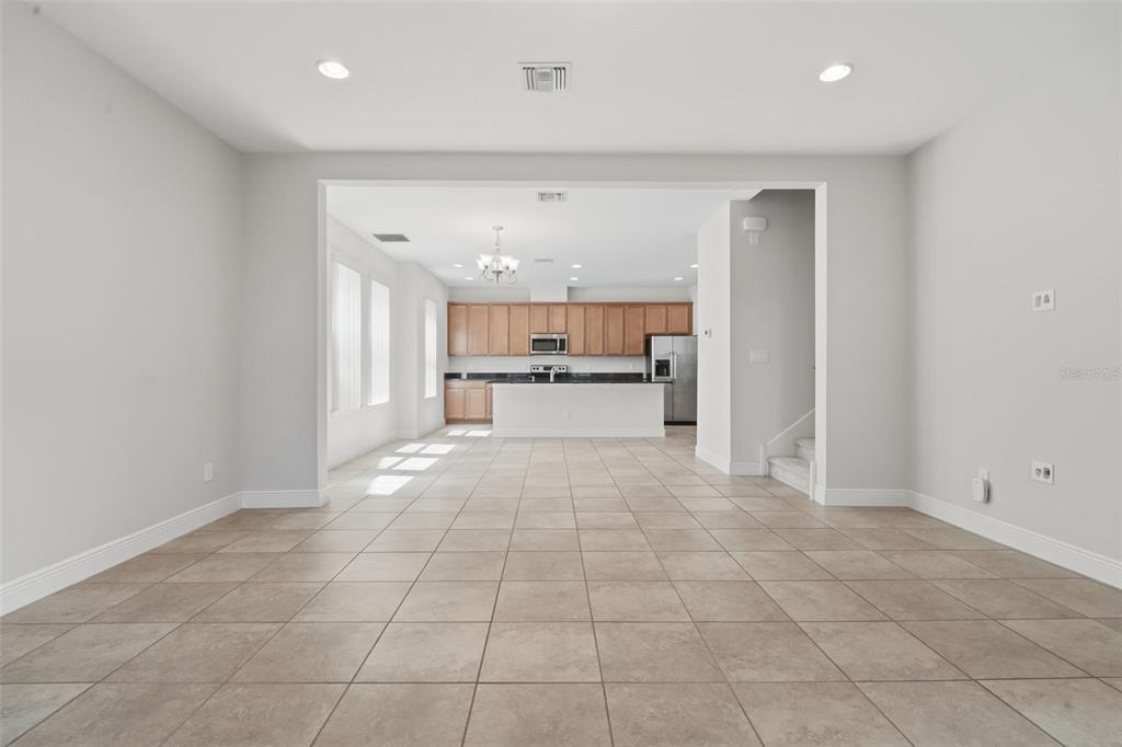 11486 Misty Oak Alley Windermere, FL 34786 - Photo 11 of 47 a large white kitchen with a sink and cabinets