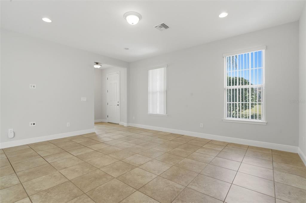 11486 Misty Oak Alley Windermere, FL 34786 - Photo 13 of 47 an empty room with windows