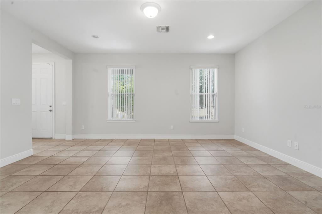 11486 Misty Oak Alley Windermere, FL 34786 - Photo 14 of 47 a view of an empty room with a window