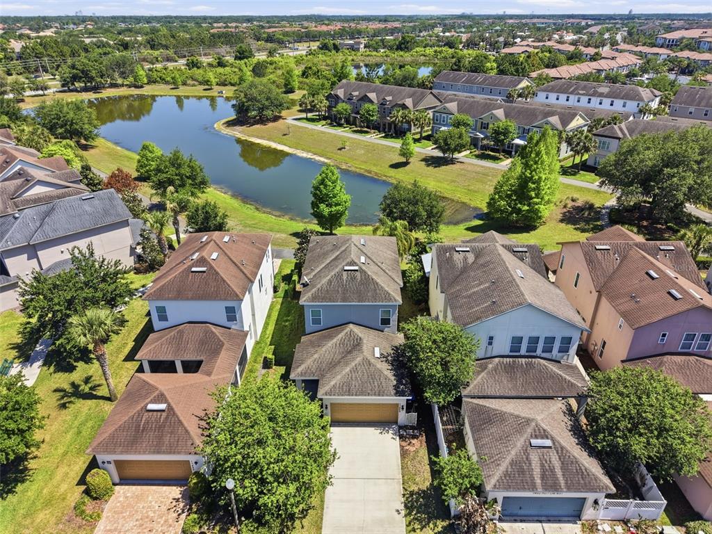 11486 Misty Oak Alley Windermere, FL 34786 - Photo 2 of 47 an aerial view of residential houses with outdoor space and river view