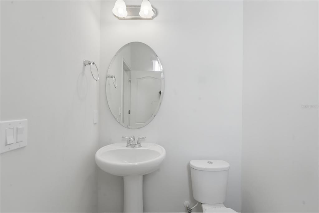 11486 Misty Oak Alley Windermere, FL 34786 - Photo 24 of 47 a bathroom with a sink a toilet and a mirror
