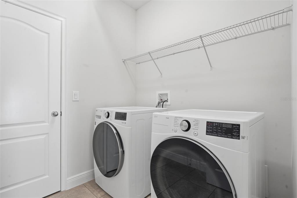 11486 Misty Oak Alley Windermere, FL 34786 - Photo 25 of 47 a utility room with dryer and washer