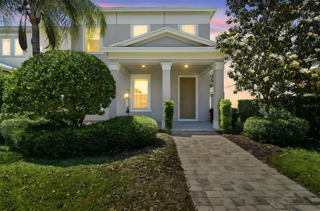 11486 Misty Oak Alley Windermere, FL 34786 - Photo 3 of 47 a front view of a house with a yard
