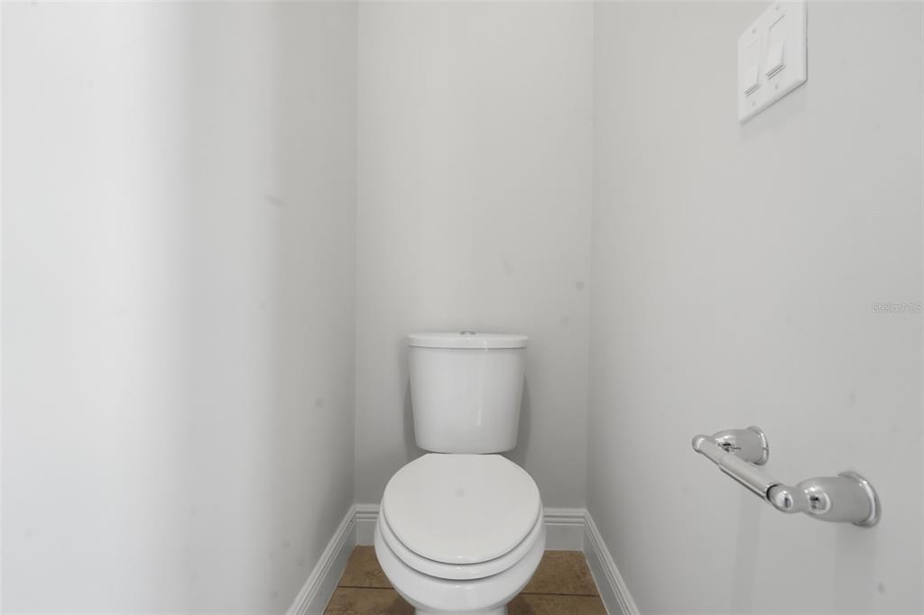 11486 Misty Oak Alley Windermere, FL 34786 - Photo 31 of 47 a white toilet sitting in a bathroom