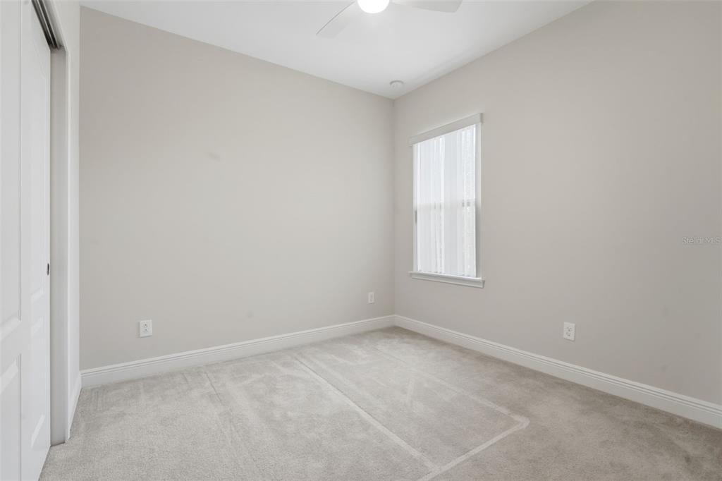 11486 Misty Oak Alley Windermere, FL 34786 - Photo 35 of 47 an empty room with a window