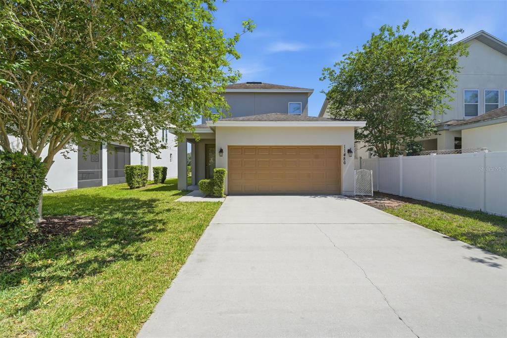 11486 Misty Oak Alley Windermere, FL 34786 - Photo 37 of 47 front view of a house with a yard and a trees