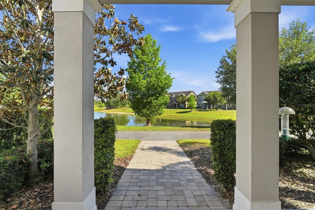 11486 Misty Oak Alley Windermere, FL 34786 - Photo 4 of 47 a view of a pathway with a yard