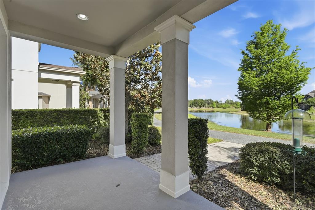 11486 Misty Oak Alley Windermere, FL 34786 - Photo 5 of 47 a view of a balcony with lake view and a garden