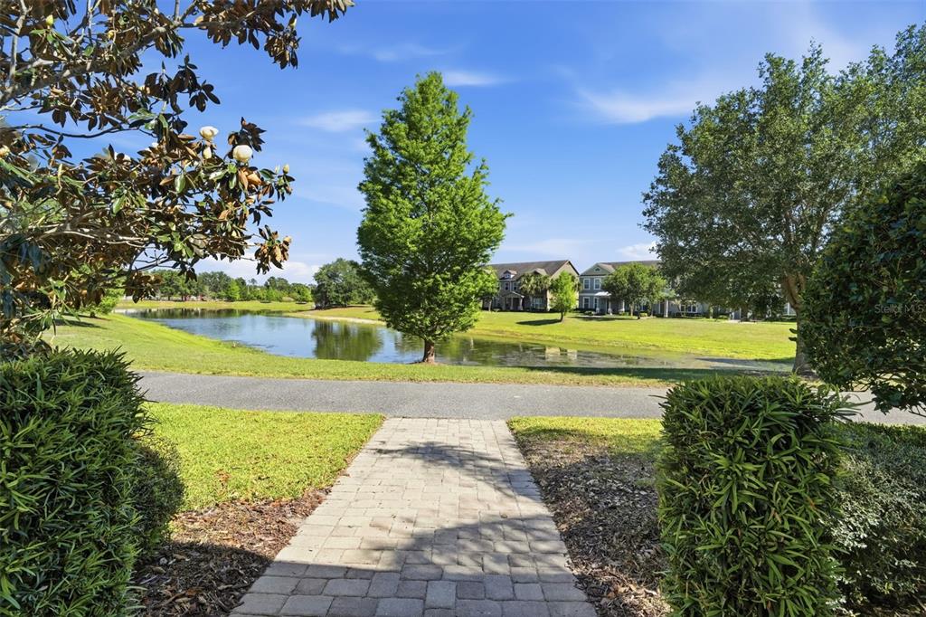 11486 Misty Oak Alley Windermere, FL 34786 - Photo 6 of 47 a view of a swimming pool with an outdoor space and seating area